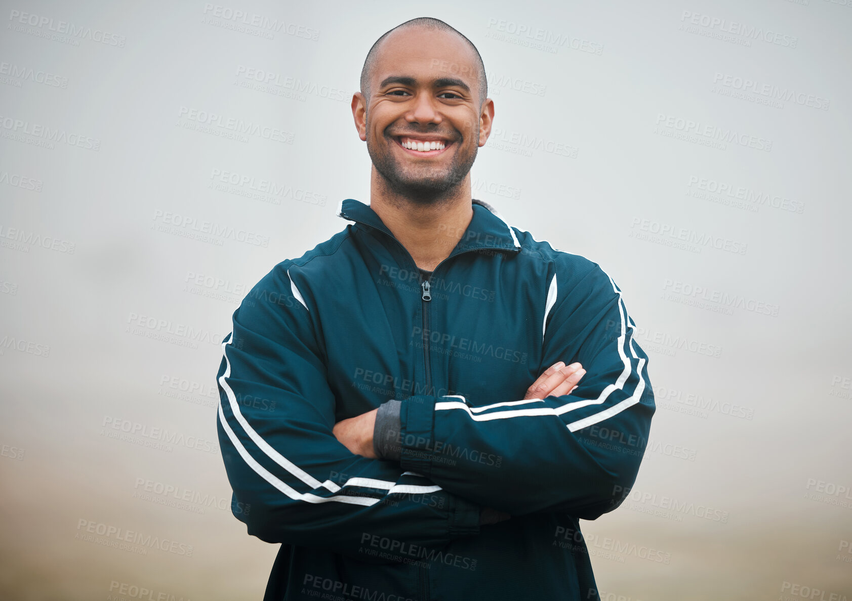 Buy stock photo Happy man, portrait and sports coach with confidence on turf for fitness, health and wellness on outdoor field. Young male person or professional athlete with smile or arms crossed in winter mist