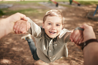 Buy stock photo Child, spinning pov and hands outdoor with portrait, fast movement or happy with support, trust or bonding in park. Boy, excited kid or flying activity on playground with smile, enjoyment and freedom