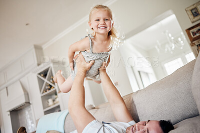 Buy stock photo Girl, kid and father with flying on sofa for game in home with imagination, playing and support with smile. Child, airplane fantasy and balance with trust, portrait and bonding with lifting in house