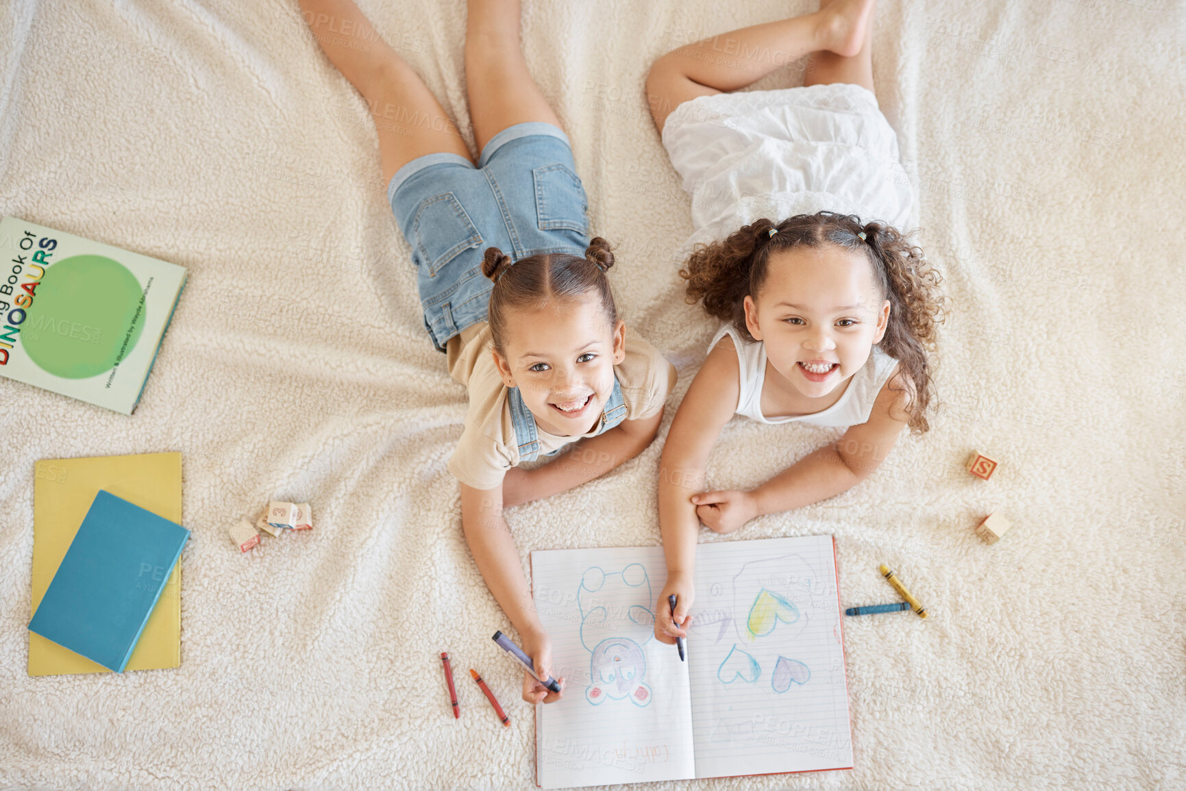 Buy stock photo Girls, above and drawing on floor in house with color pencil in book for development as sisters. Children, writing and learning in home with crayon or paper for kindergarten, homework or education