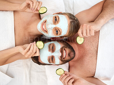 Buy stock photo Couple, portrait and facial with cucumber in spa for face glow, skincare and self care together. Above man, happy woman and beauty mask with fruit for dermatology, wellness and peace in luxury salon