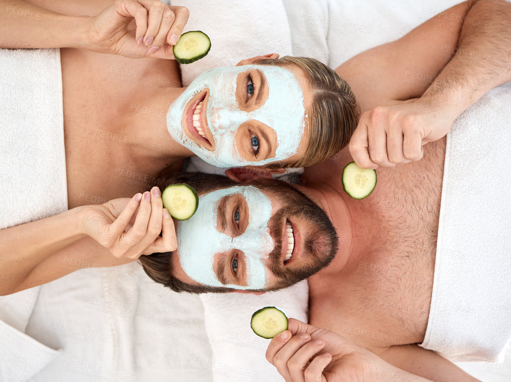 Buy stock photo Couple, portrait and facial with cucumber in spa for face glow, skincare and self care together. Above man, happy woman and beauty mask with fruit for dermatology, wellness and peace in luxury salon