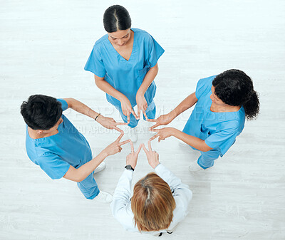 Buy stock photo Above, star or hands of doctors in hospital with teamwork in nurses collaboration for healthcare goal. About us, team building or top view of medical group with support shape, motivation or mission