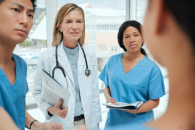 Buy stock photo Teamwork, talking or doctors with leadership in meeting planning a surgery strategy in collaboration. Discussion, nurses or surgeons speaking of healthcare paperwork documents or research report