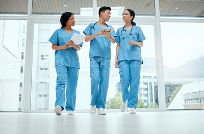 Buy stock photo Teamwork, discussion or medical students walking or planning a surgery strategy in collaboration. Internship, doctors or young surgeons with tablet talking, working or speaking of hospital healthcare