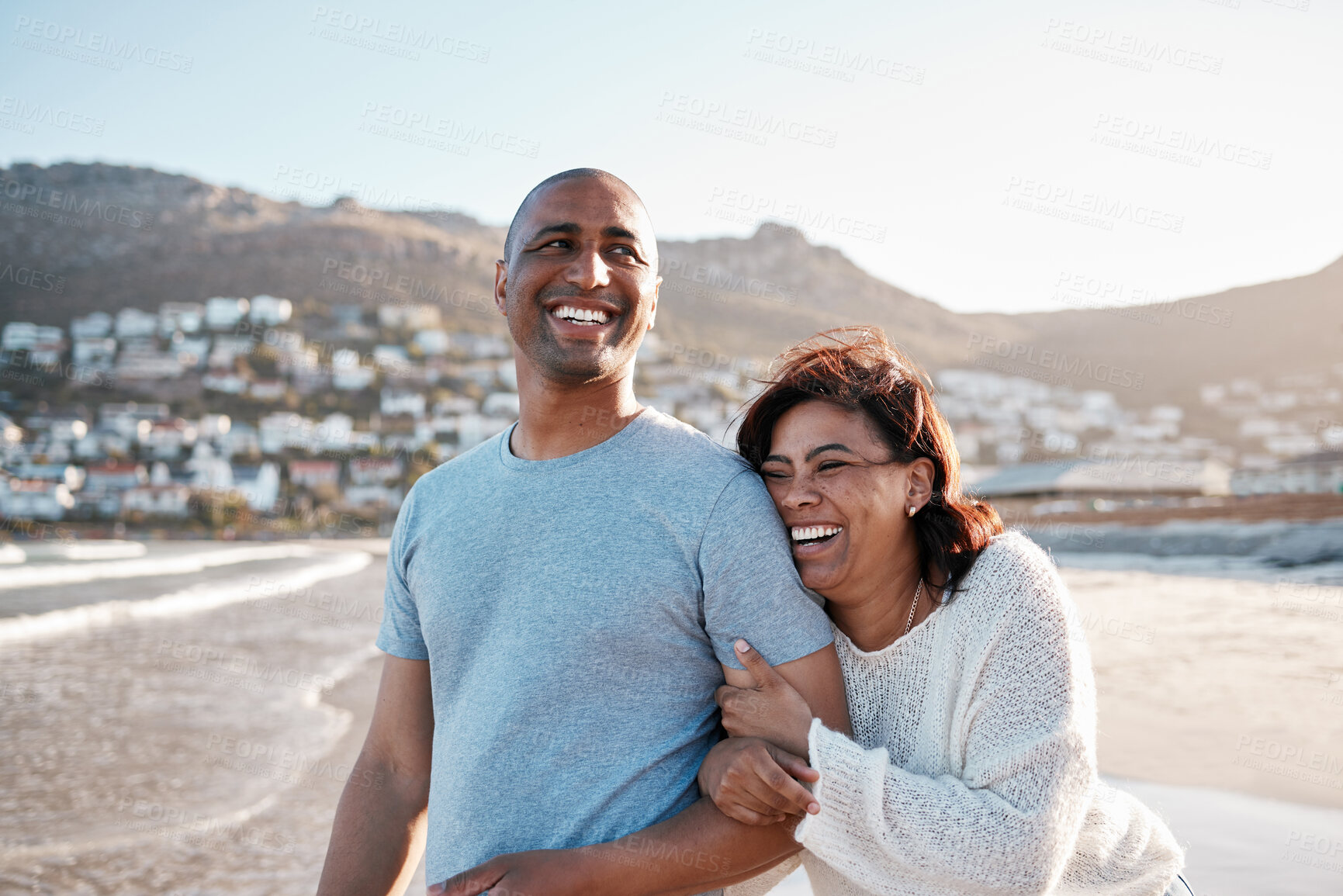 Buy stock photo Couple, laughing and relax on beach vacation, romance and humor for bonding in healthy marriage. People, happiness and outdoor holiday for relationship, funny conversation and support or humor at sea