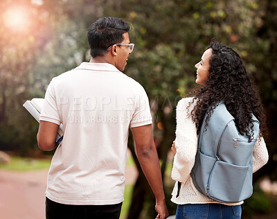 Buy stock photo University, students and walking to class on campus for conversation, education or knowledge. Back, young man and happy woman with backpack for learning, talking or scholarship with lens flare