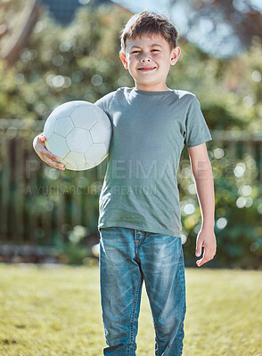 Buy stock photo Boy, child and soccer ball in portrait on grass, happy and backyard in summer at family house. Kid, outdoor and football for game, playful and learning on lawn in sunshine with smile in Los Angeles