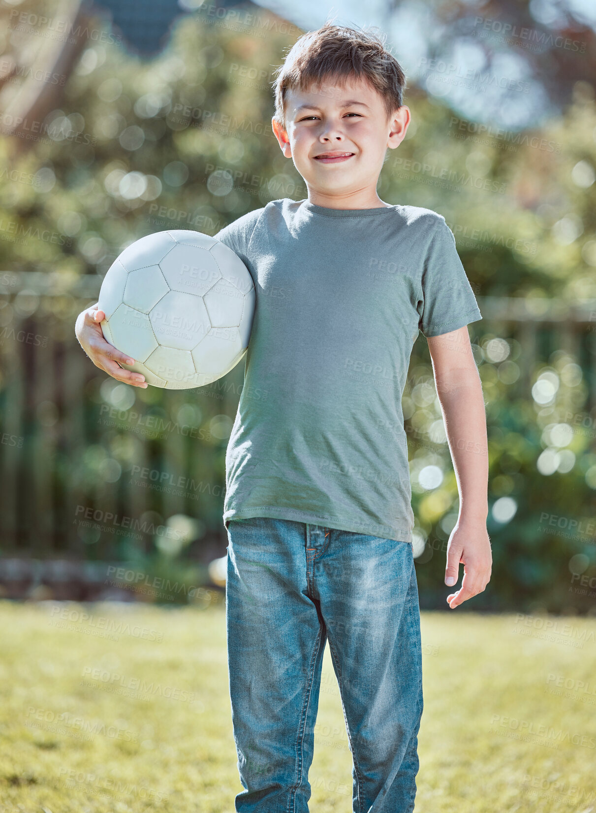 Buy stock photo Boy, child and soccer ball in portrait on grass, happy and backyard in summer at family house. Kid, outdoor and football for game, playful and learning on lawn in sunshine with smile in Los Angeles