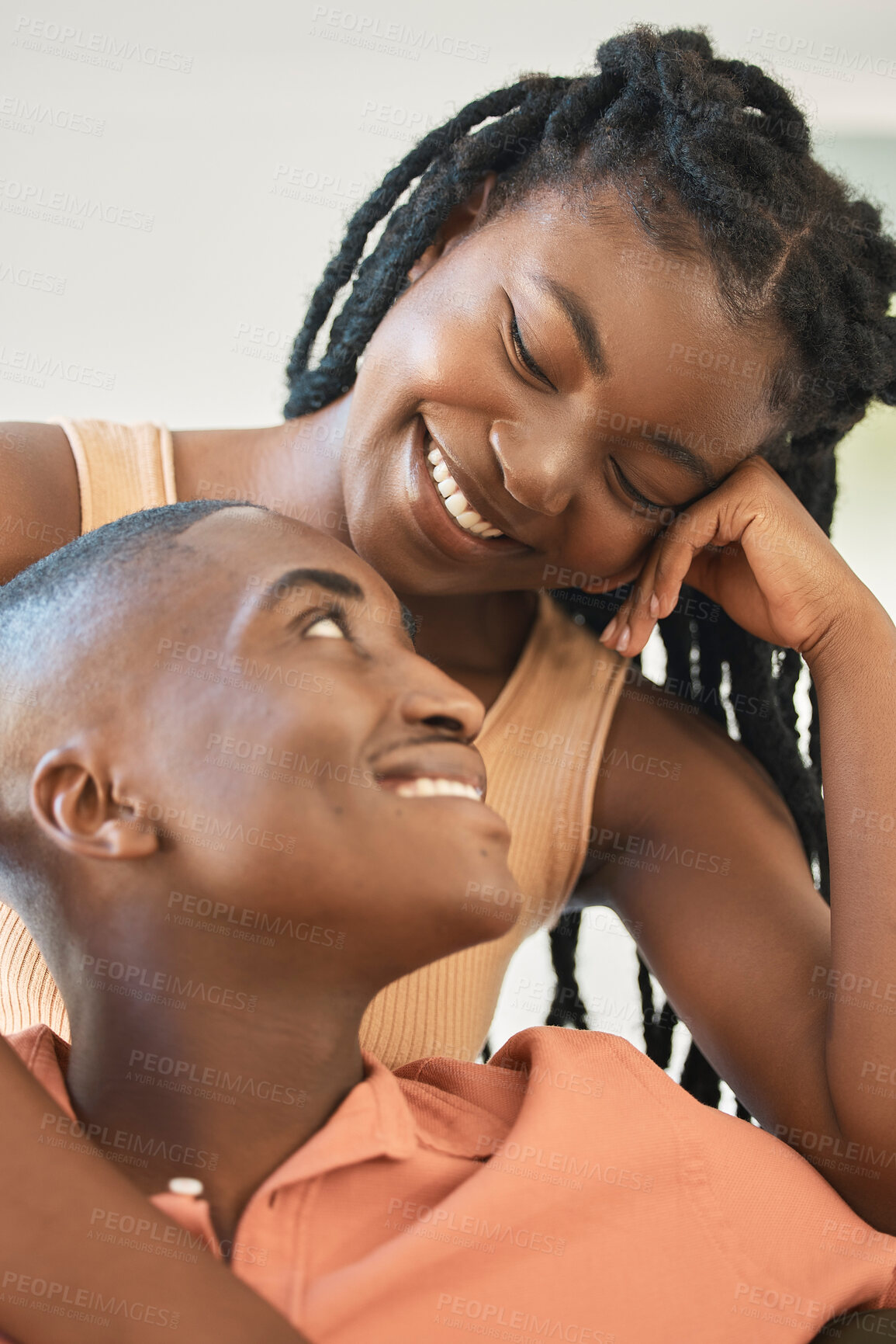 Buy stock photo Love, peace or black couple in home to relax, smile or enjoy anniversary together for loyalty or trust. Chill, romantic woman or African man bonding in bedroom for care, support or special moment