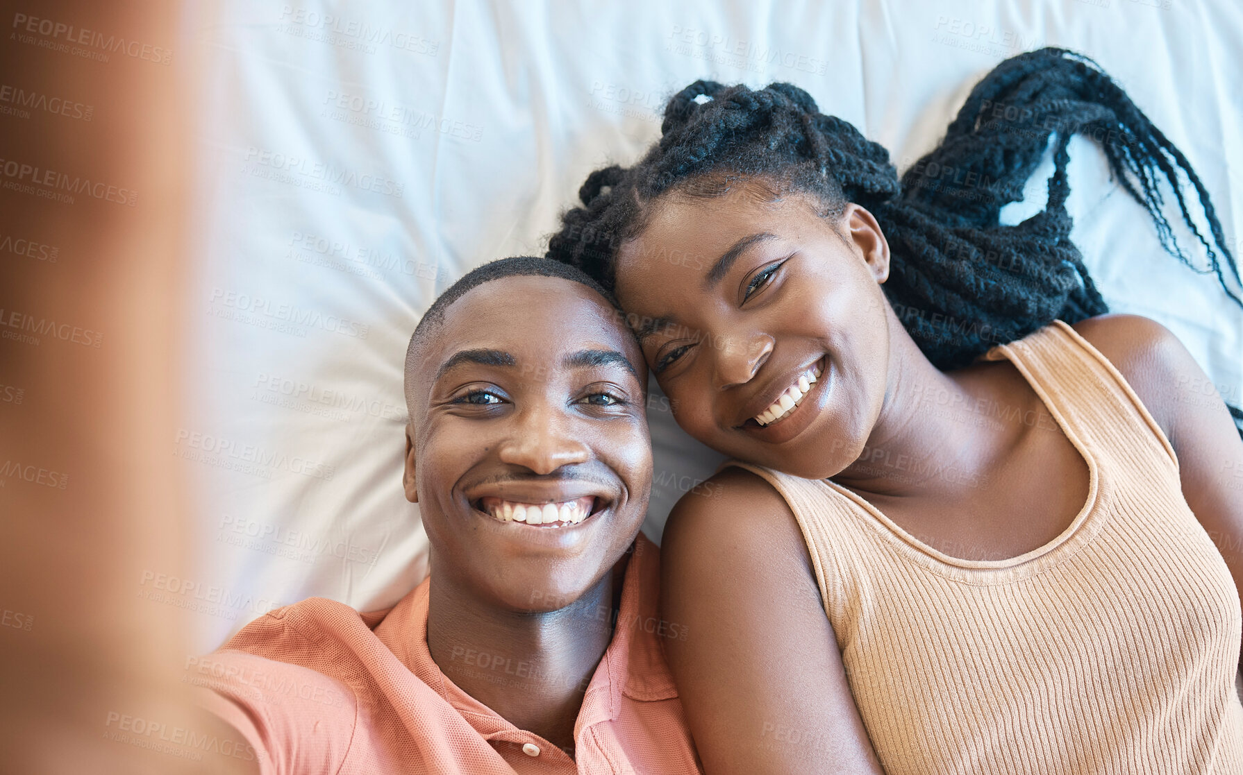 Buy stock photo Black couple, smile and selfie portrait on bed for love relationship, happy memory and bonding in home. African woman, man and profile picture on mattress for social media, care and anniversary post