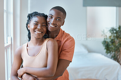 Buy stock photo Love, portrait or black couple hug in bedroom to relax, smile or enjoy anniversary together for peace or trust. Happy, romantic woman and man bonding in apartment for home, support or special moment