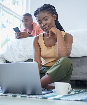 Buy stock photo Black couple, laptop and phone with relax in home for streaming multimedia, networking and connection. African people, internet and technology in bedroom for communication, news app and online scroll