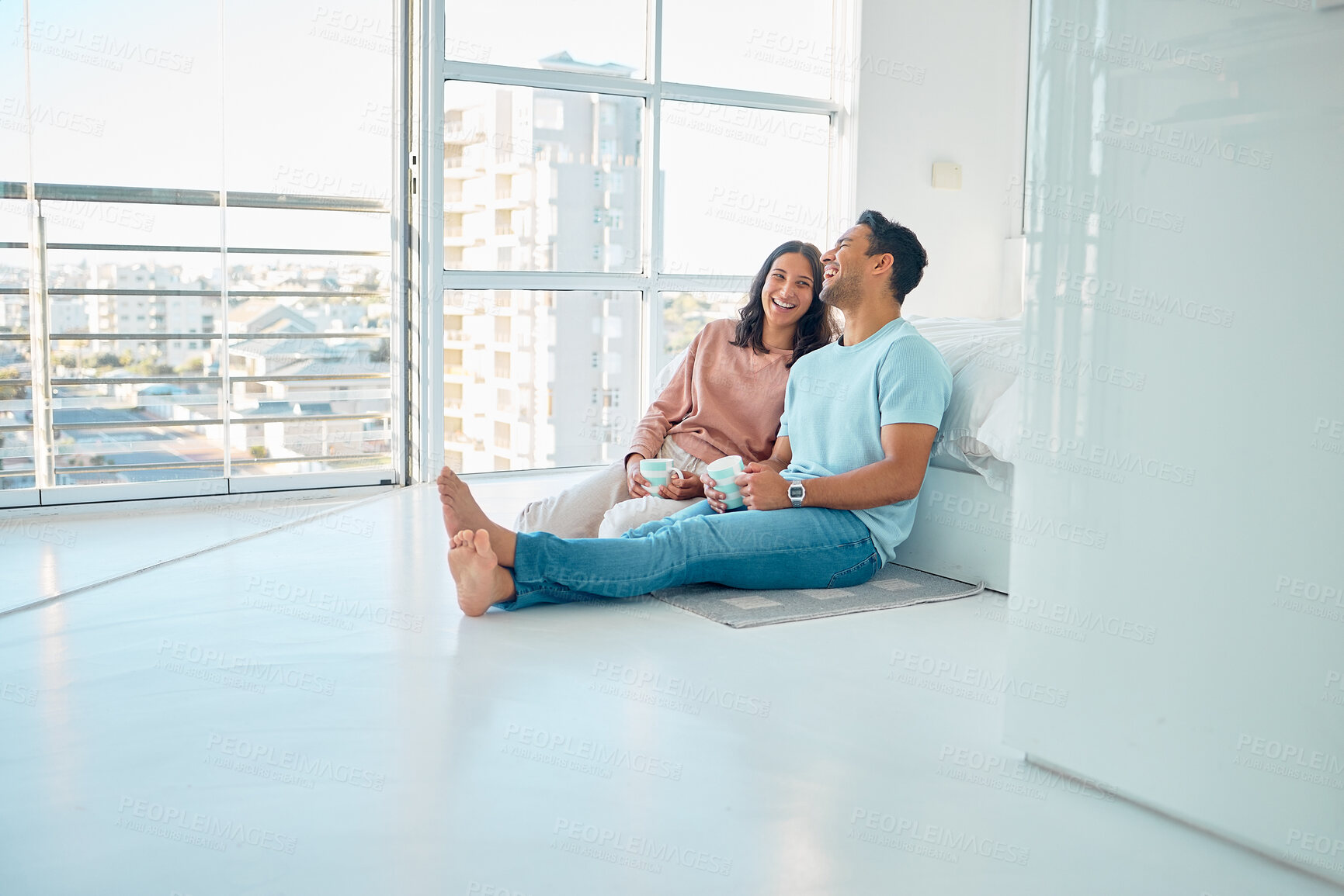 Buy stock photo Home, couple and drinking coffee on floor in bedroom for moving, property investment or mortgage. Morning, hispanic man and happy woman on ground for relocate, purchase or real estate in apartment