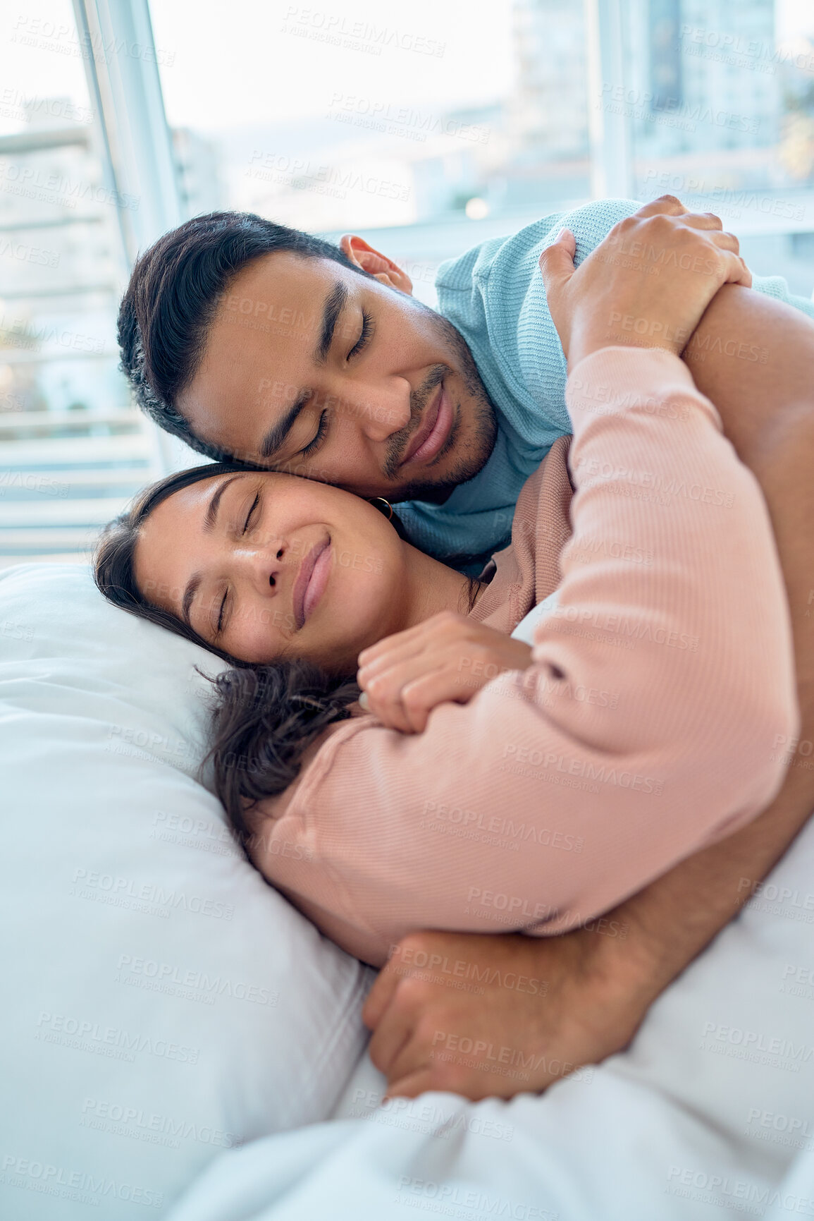 Buy stock photo Couple, hug and smile in bedroom, morning and love on bed with bonding, care and romance in home. Man, woman and embrace with happiness, holiday or vacation in hotel, room or apartment with affection