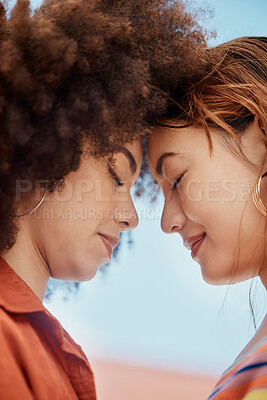 Buy stock photo Couple, lesbian and forehead touch in outdoor, bonding and blue sky for security. People, lgbtq and hug for romance on holiday or together for profile date, support partner and embrace on vacation