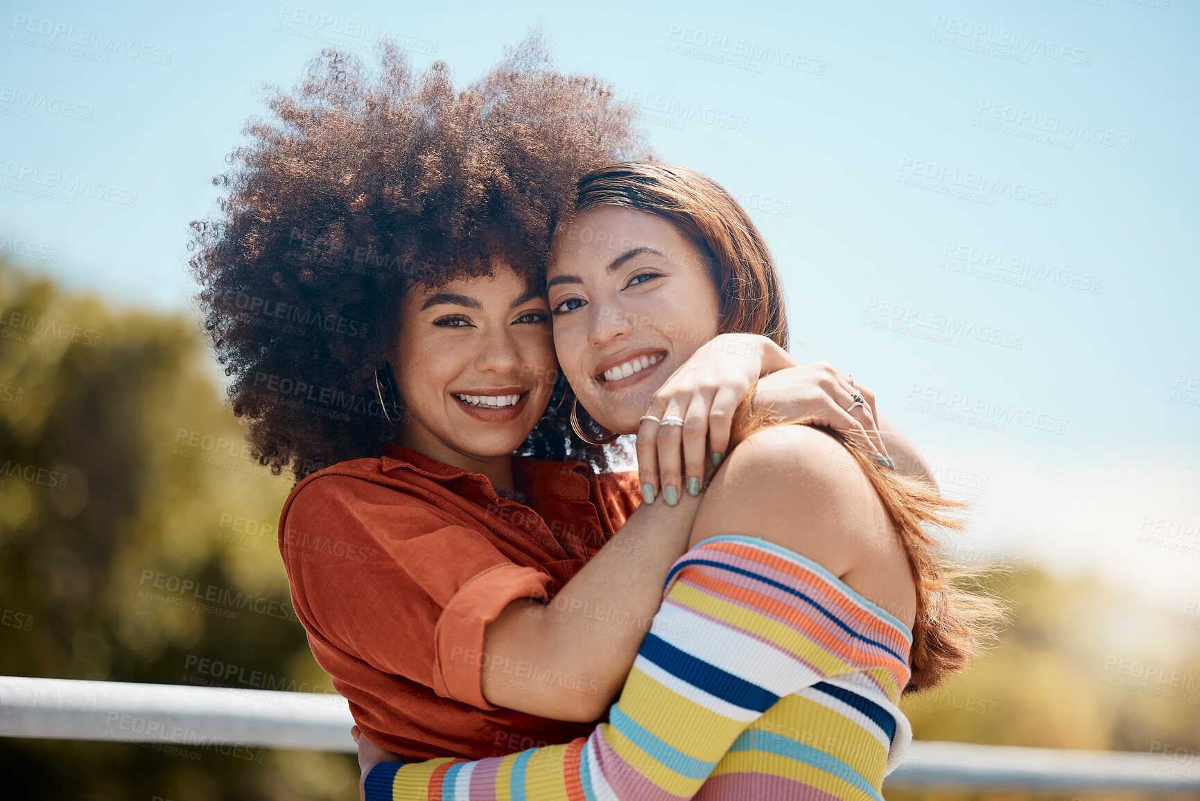 Buy stock photo Couple, lesbian and hug in outdoor portrait, bonding and together for security in nature. Happy people, lgbtq and embrace for romance on balcony, support and trust in connection or love for partner