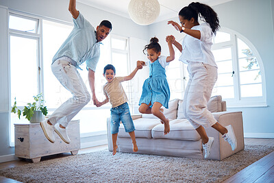 Buy stock photo Happy family, jumping and playing with energetic children for bonding, weekend or holiday at home. Mother, father and kids enjoying fun activity in air with parents in living room together at house