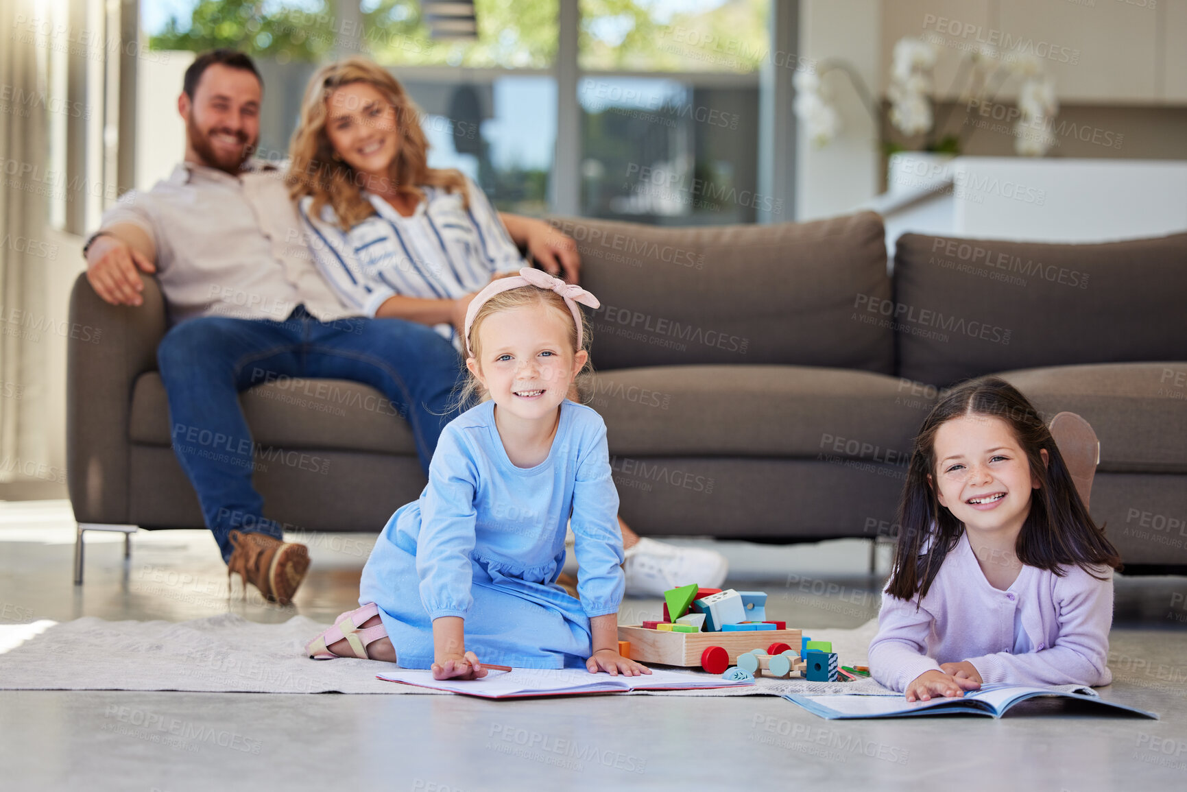 Buy stock photo Children, play and floor with toys and parents on couch, smile and portrait in home living room. Relax, drawing and girls for playdate with friend in lounge, mother and dad person on sofa for rest