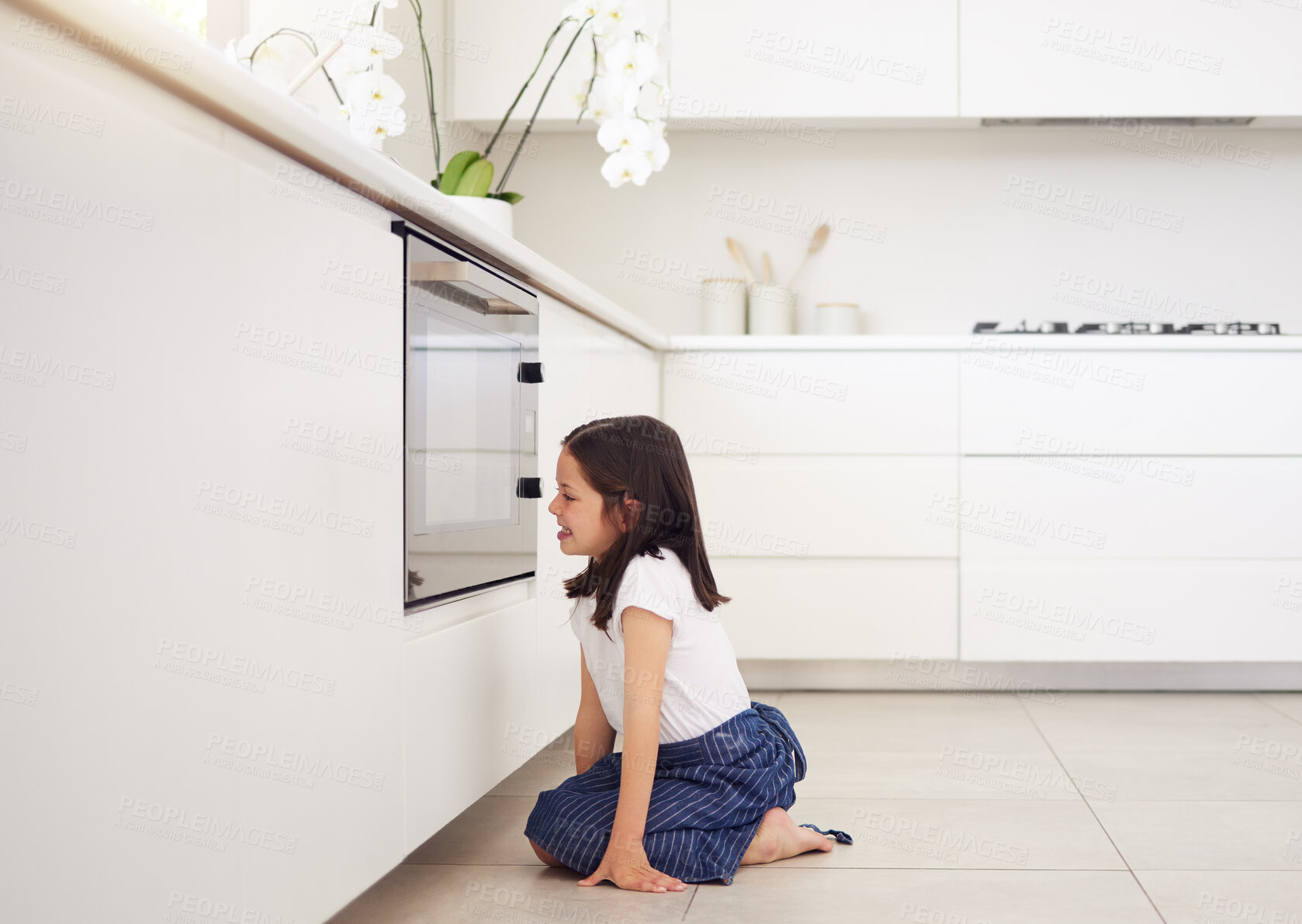 Buy stock photo Baking, oven or waiting and girl in kitchen of home for patience at cooking food with appliance. Excited, happy and smile of child baker on floor of apartment for development, diet or growth