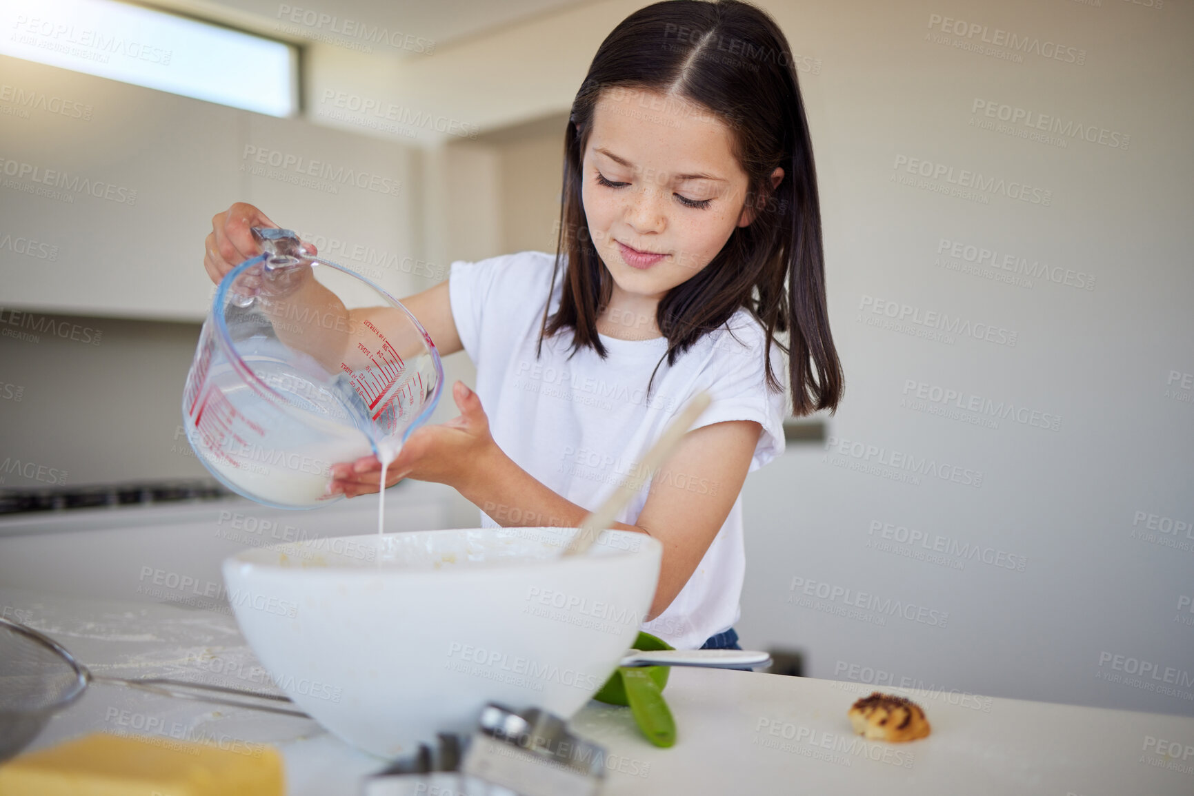 Buy stock photo Kitchen, baking and child with ingredients, smile and preparing of dessert, growth and development. Home, girl and learning with dough for cake, test and cooking assignment for school project in USA