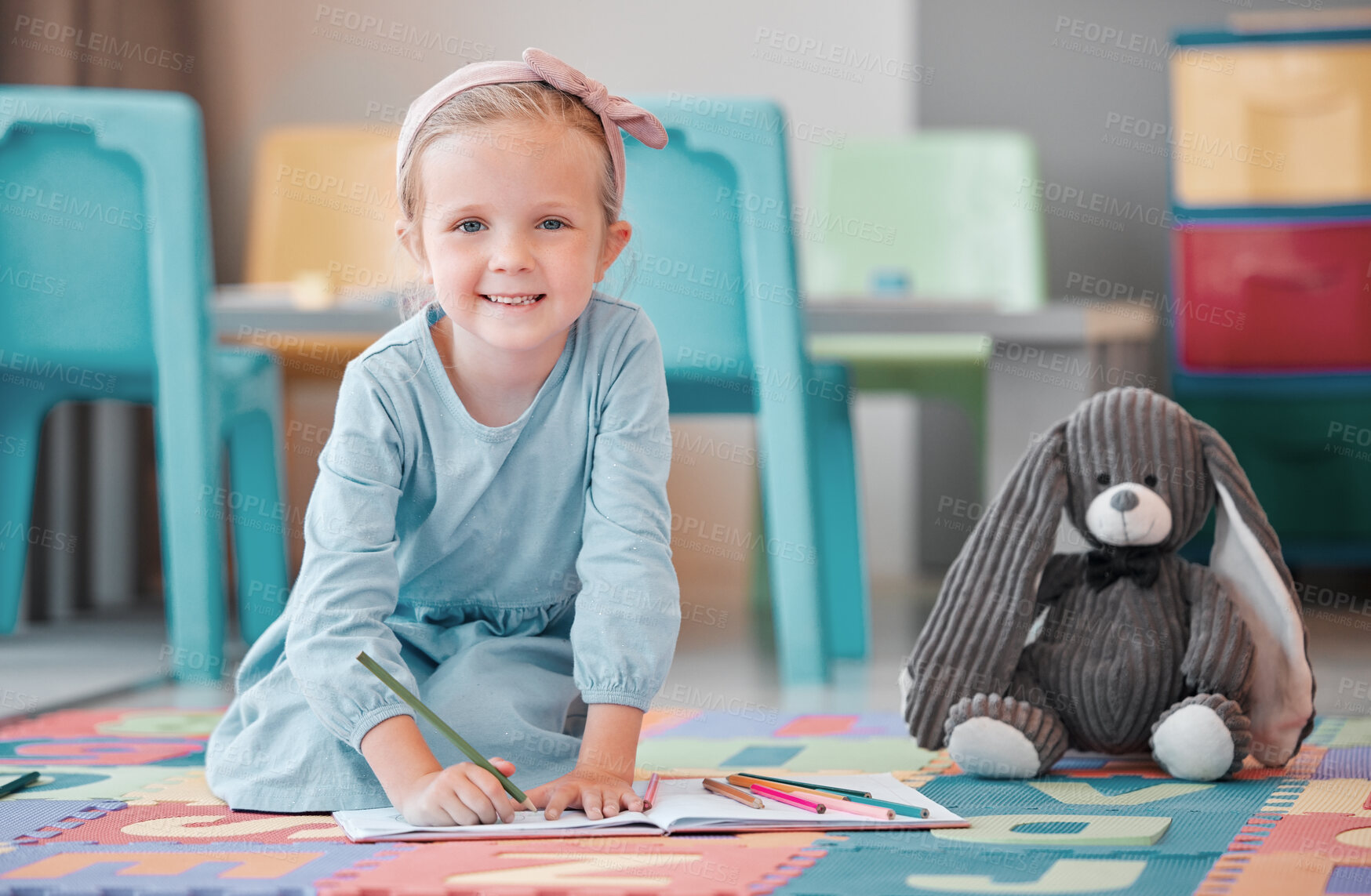 Buy stock photo Notebook, teddy bear and portrait of child writing in psychology office for social development. Smile, plush toy and girl kid drawing on floor at healthcare clinic for cognitive behavioral therapy.