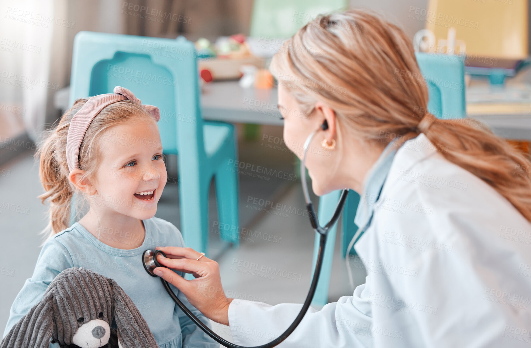 Buy stock photo Healthcare, child and doctor for checkup with stethoscope, wellness and health for sound with smile. Hospital, female pediatrician and girl for medical exam, heart rhythm and respiratory wellbeing