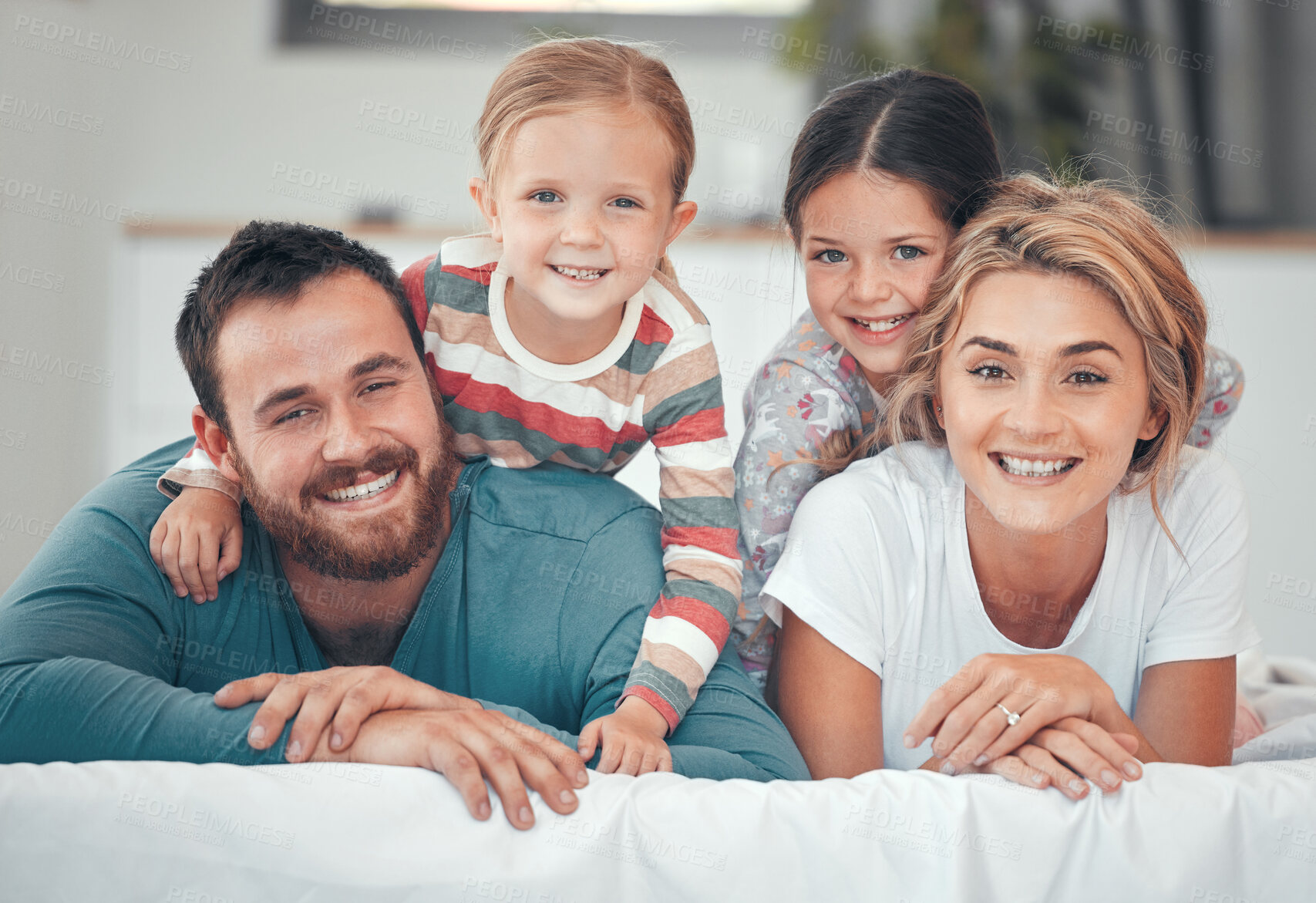 Buy stock photo Mother, dad and children on bed in portrait for happiness, bonding and relax together with on weekend. Family, face and support in home with smile for wellness, relationship and care in morning