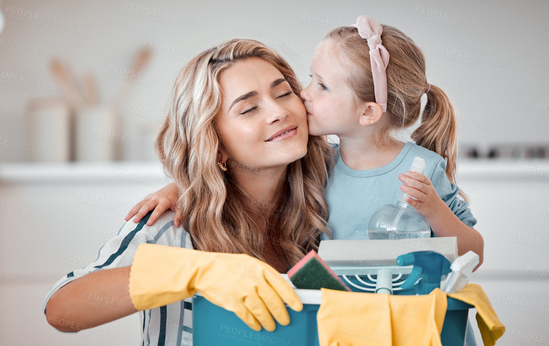 Buy stock photo Household, mother and child with kiss in kitchen, product and container for cleaning with smile. Home, mom and happy girl with spray for hygiene, bonding and kid for helping parent in apartment