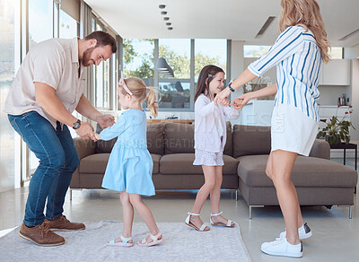 Buy stock photo Parents, children and dance in home, smile and bonding in living room with learning for rhythm. Father, mother and daughter siblings with care, love and holding hands for connection in family house