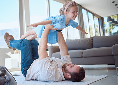 Buy stock photo Father, girl and lifting for airplane on floor with games, playful and love with connection in living room. Dad, child and daughter with flight, plane and balance on lounge carpet in family home