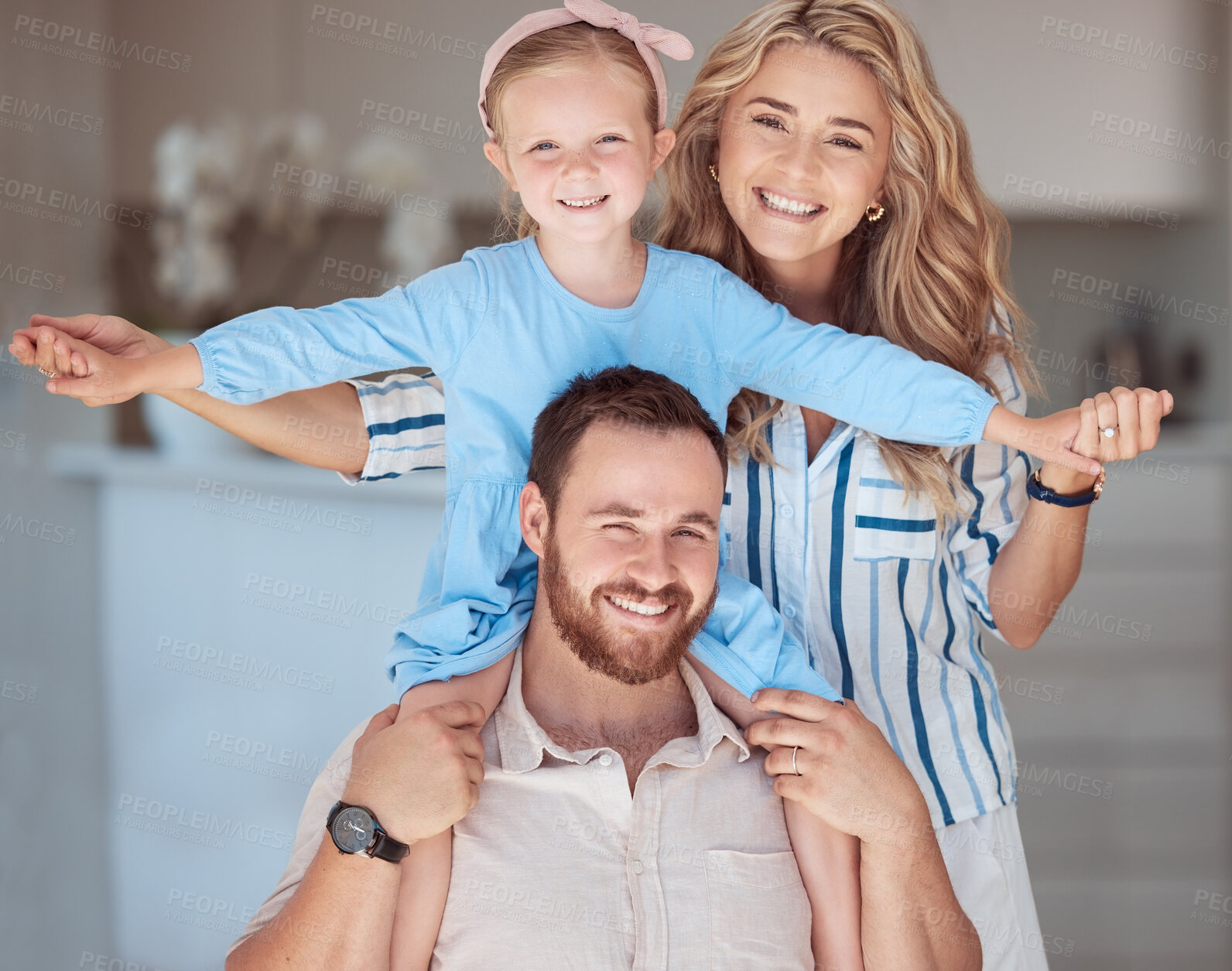 Buy stock photo Parents, girl and portrait on shoulders in home with plane, care or games with holding hands with smile. Father, mother and daughter with love, connection or family with airplane for flight in lounge