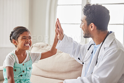 Buy stock photo Doctor, girl and high five in home with smile excited and support for results with wellness on sofa. Pediatrician, man and child at family house, cheers and celebration for good news in Indonesia