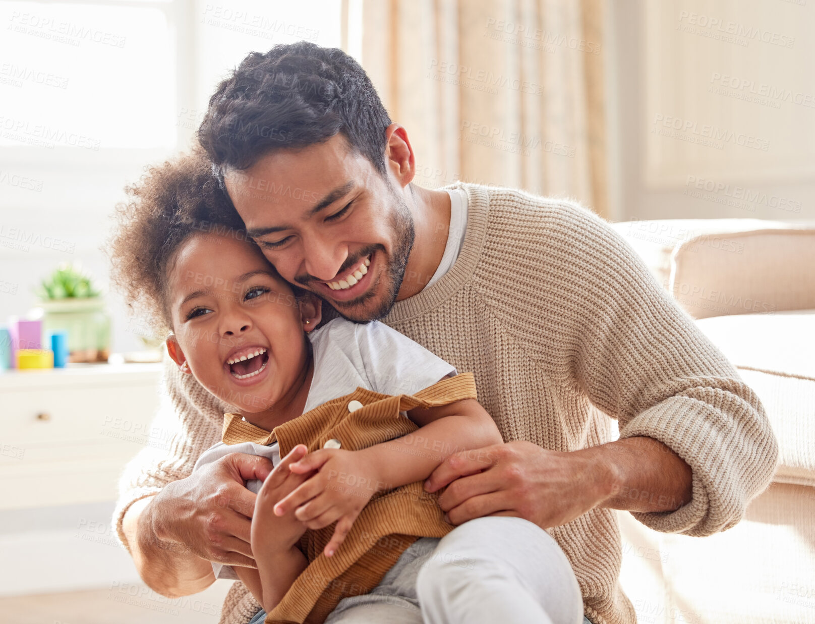 Buy stock photo Father, girl and playing or laughing in home with bonding, fun activity and tickling in living room. Family, man and daughter with love, security and comic game with happiness, care and parenting