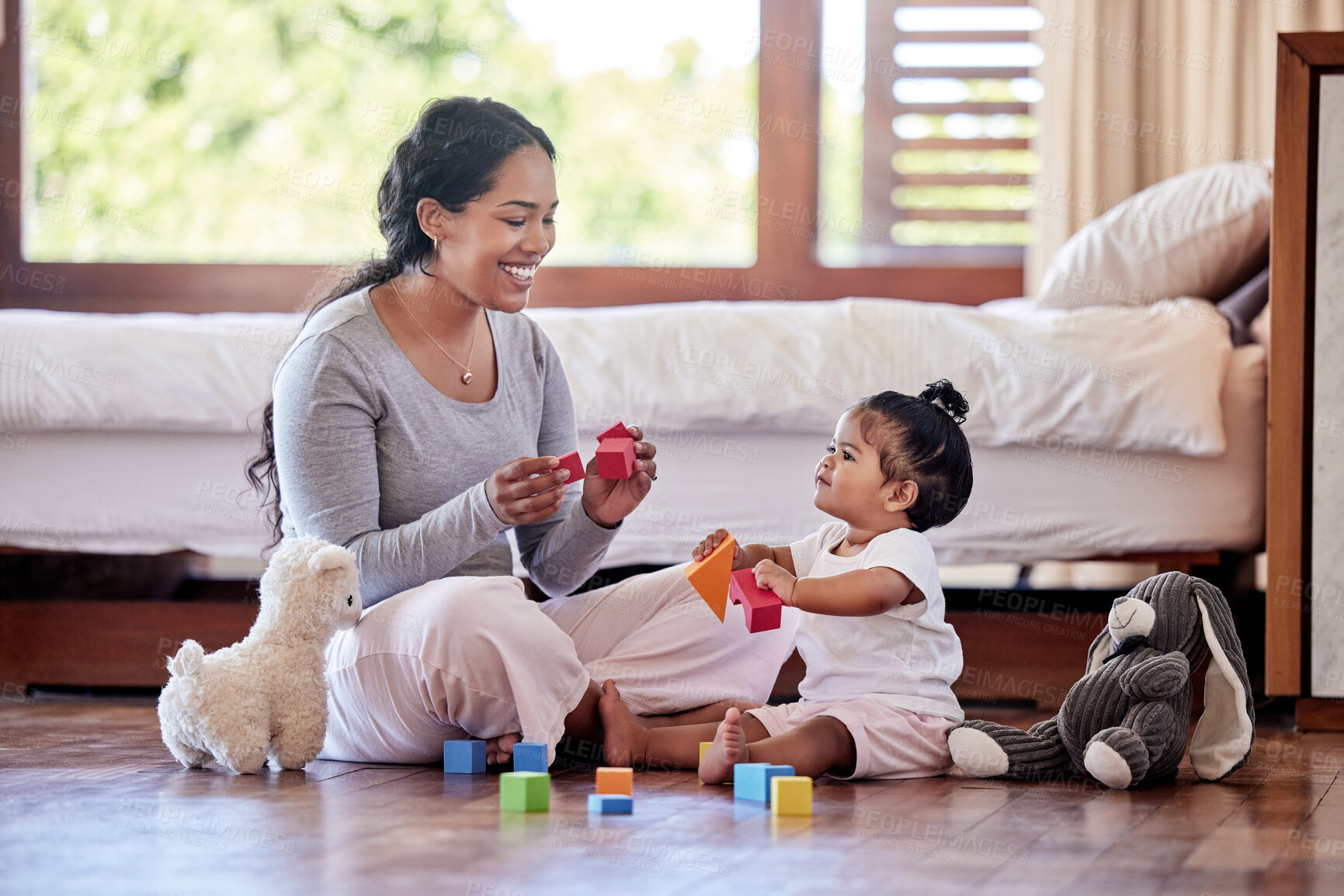 Buy stock photo Mom, baby and playing on floor in house for love, development or bonding together with toys. Mother, toddler and fun in apartment bedroom for growth, wellness and learning with teddy bear or game