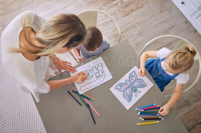 Buy stock photo Mother, kids and above with drawing in kitchen for development, learning art with support for growth. Mom, children or home with pencil for color picture or creativity, process with teaching at table