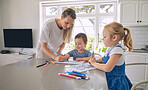 Young single caucasian mother helping her two cute little children with their homework in a bright kitchen. Two siblings doing their school project with their mom at home 