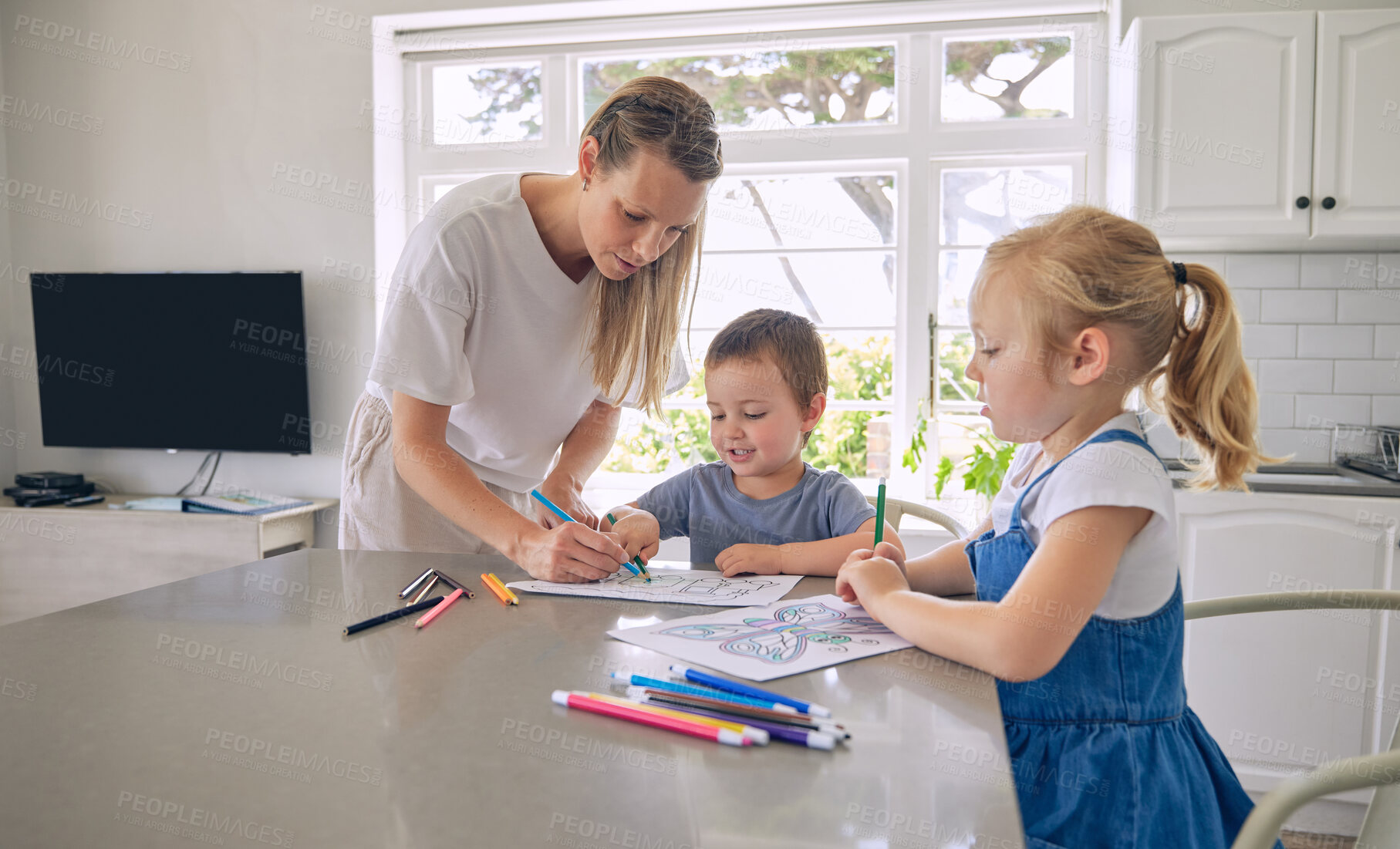 Buy stock photo Mother, kids and help with drawing in kitchen for development, learning art with support for growth. Mom, children and home with pencil for color picture or creativity, process with teaching at table