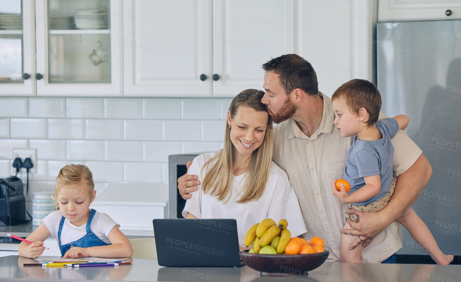 Buy stock photo Family, kiss and parents and laptop with children for homework, study and remote work on kitchen counter. Tutor, education and students for distance learning, home school and support with mother