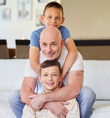 Buy stock photo Hug, portrait and father with children on sofa for bonding, relationship and relax on weekend. Family, home and mature dad with kids embrace on couch in living room for happiness, love and fun