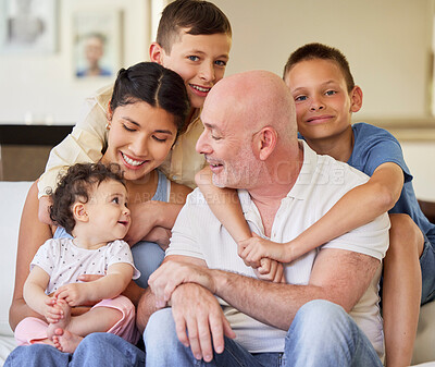 Buy stock photo Happy, sofa and mom, dad and children for bonding, relationship and relax on weekend. Family, smile and home with kids embrace with baby in living room for conversation, love and fun together