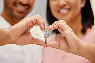 Buy stock photo Heart, hands and couple with key in new home for property ownership, real estate and support. Smile, woman and man with investment in house for marriage residence, growth and mortgage in immigration