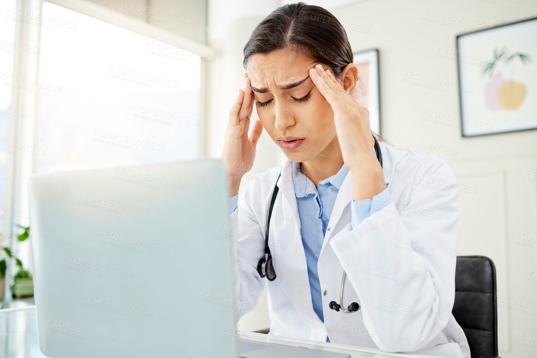 Buy stock photo Doctor, woman and laptop with headache from stress in office with burnout, overworked or mental health at desk. Medical, professional or frustrated with migraine, anxiety or ache from clinic overtime