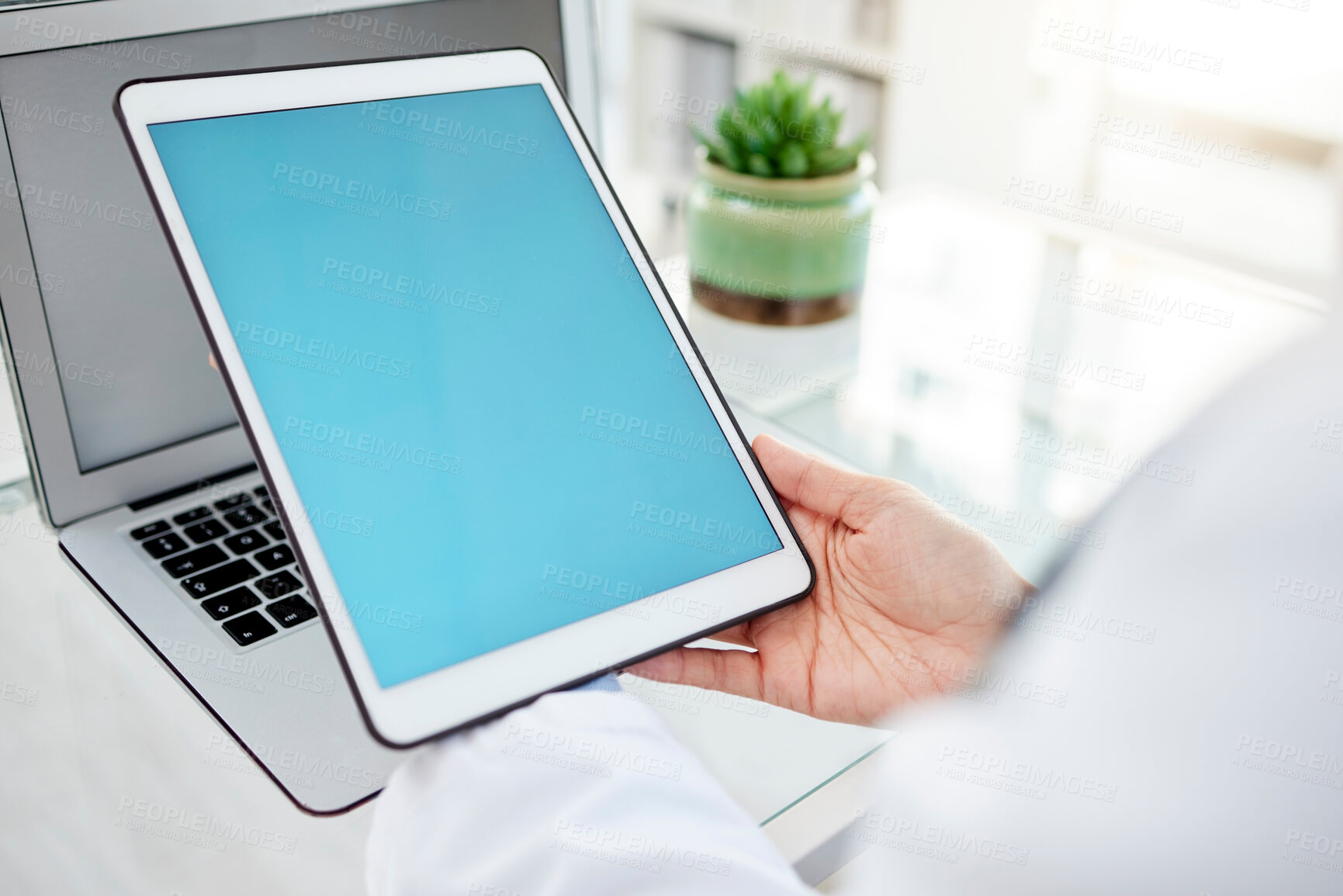 Buy stock photo Green screen, tablet and hands of doctor in hospital with laptop for telehealth consultation. Mockup space, chroma key and digital technology for medical data research for online healthcare in clinic