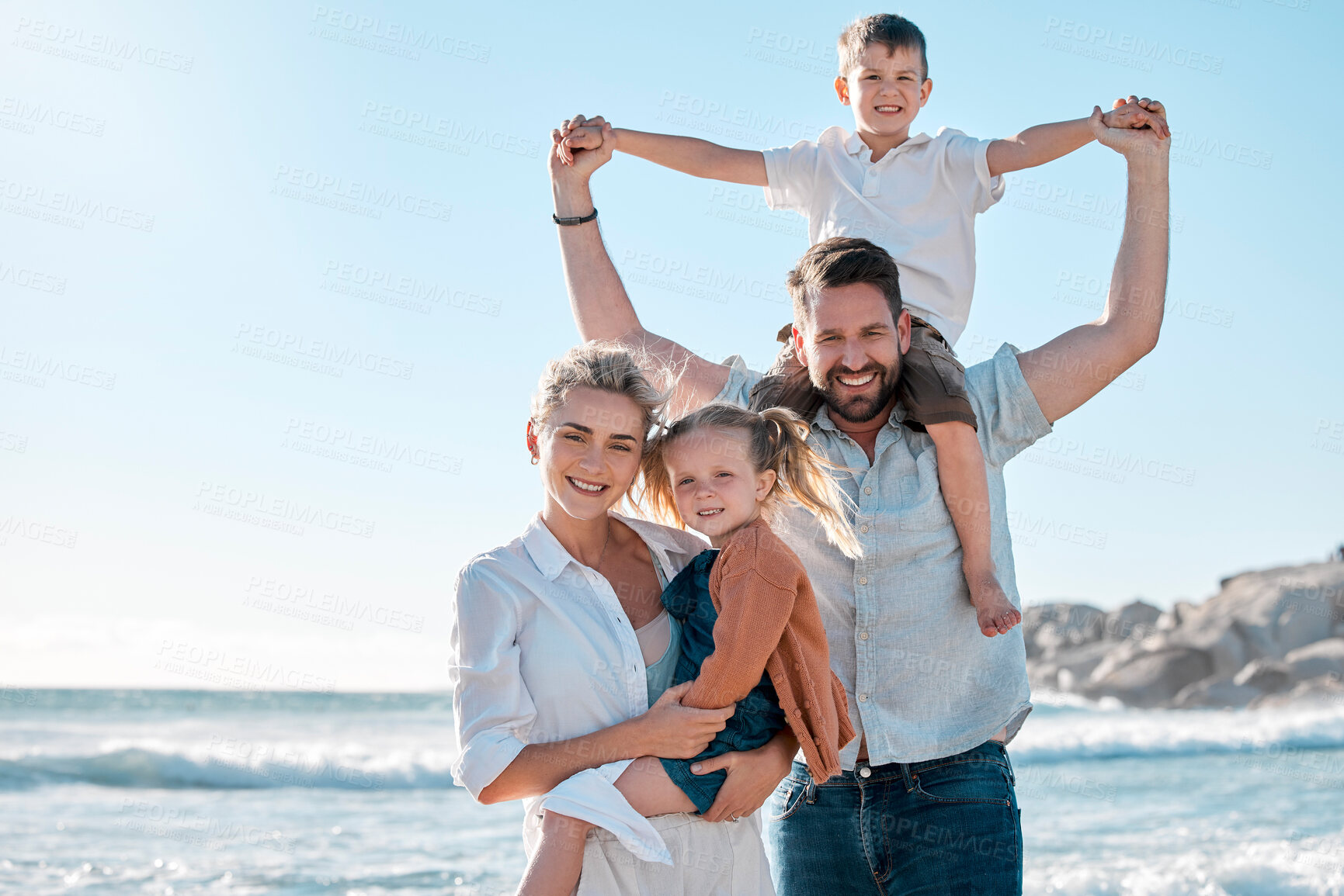 Buy stock photo Portrait of mom, dad and kids by beach for holiday, vacation and adventure in nature. Family, travel and father, mother and children by ocean for bonding, relationship and fun by seaside to relax