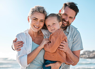 Buy stock photo Beach, happy and portrait of parents with child for holiday, vacation and adventure in nature. Family, travel and mom, dad and girl by ocean for bonding, relationship and fun by seaside to relax