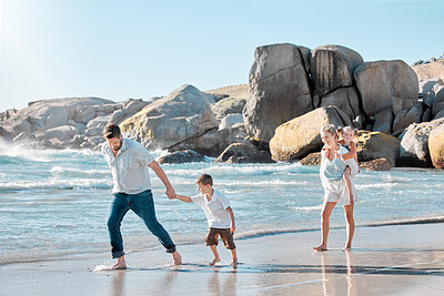 Buy stock photo Parents, children and walking on beach for holiday with bonding, piggyback and summer vacation. Happy family, couple and kids in water at ocean for getaway trip, travel and scenery with love and care