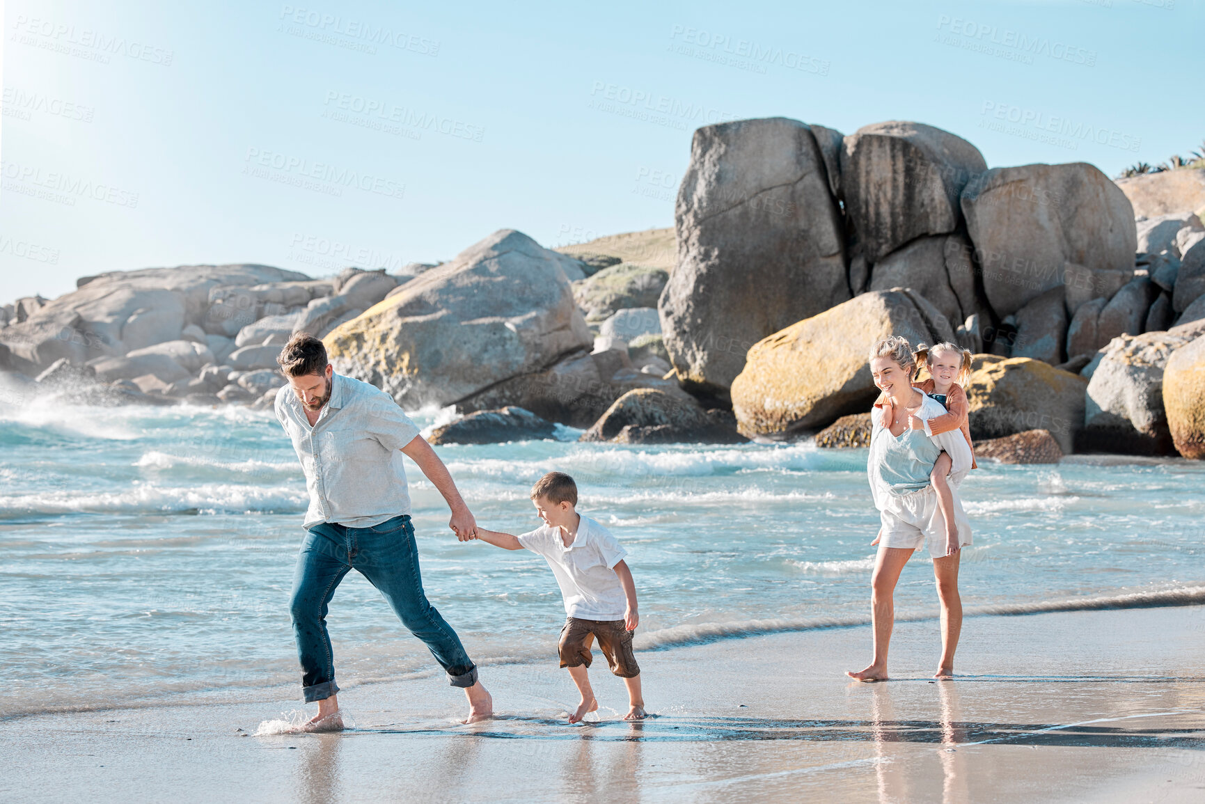 Buy stock photo Parents, children and walking on beach for holiday with bonding, piggyback and summer vacation. Happy family, couple and kids in water at ocean for getaway trip, travel and scenery with love and care