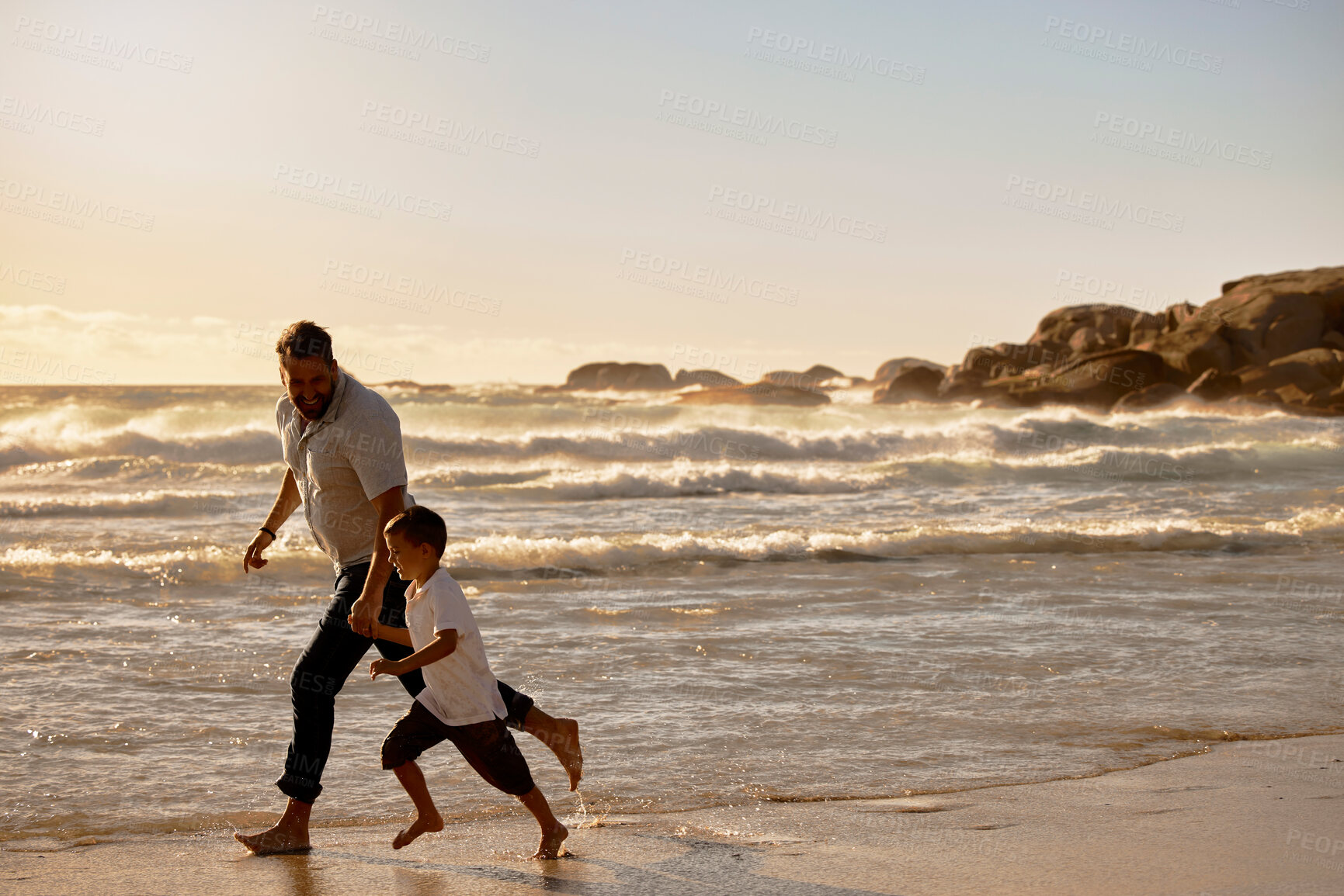 Buy stock photo Sunset, dad and kid holding hands on beach for holiday adventure together in tropical island waves. Running, father and boy child on ocean vacation with travel, support and happy bonding in Australia