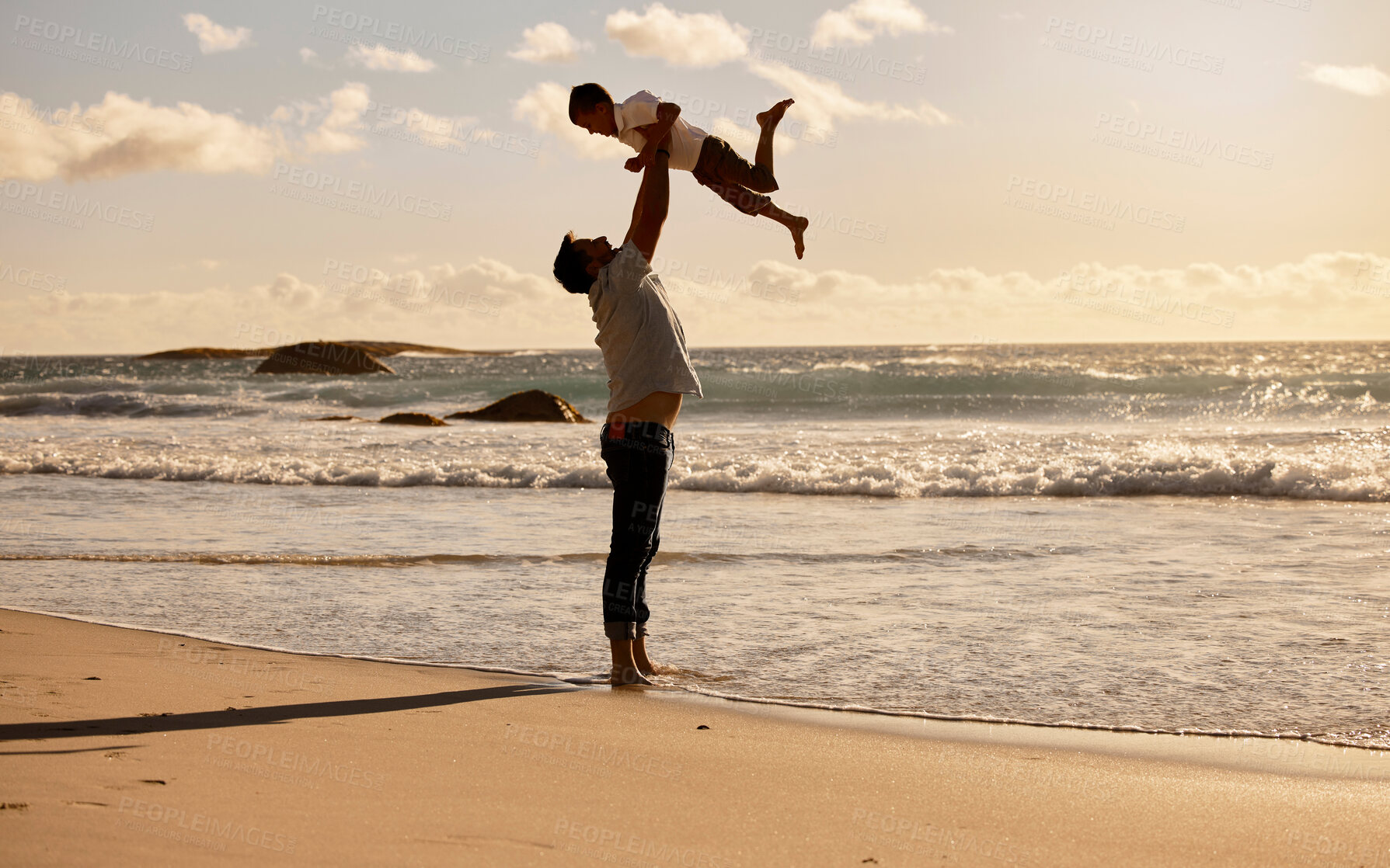 Buy stock photo Beach, playing and dad with child in air for holiday, vacation and adventure in nature. Family, summer and father throw boy by ocean for bonding, relationship and fun outdoors by seaside to relax